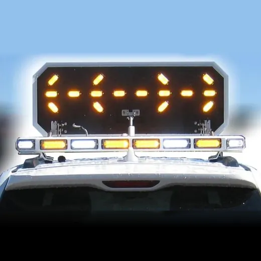 D&R Mini Odyssey arrowboard raised above a white lightbar, amber LEDs lit in a split arrow pattern