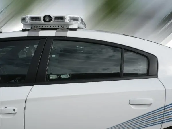 D&R WB-CHARGER window bars in the rear side window of a white Dodge Charger police cruiser