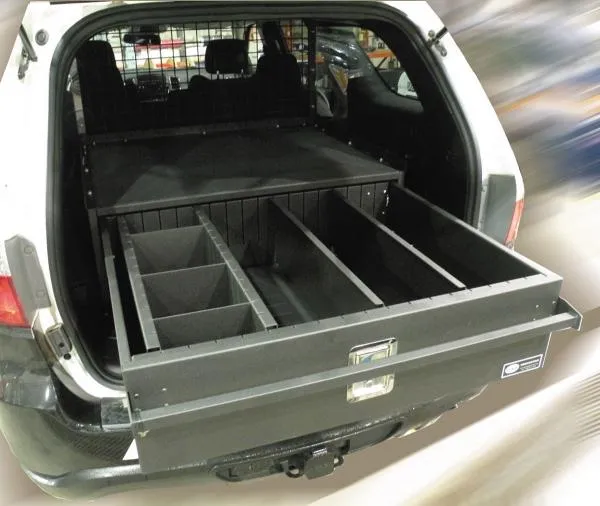 Drawer pulled fully open showing adjustable dividers splitting the tray into separate compartments