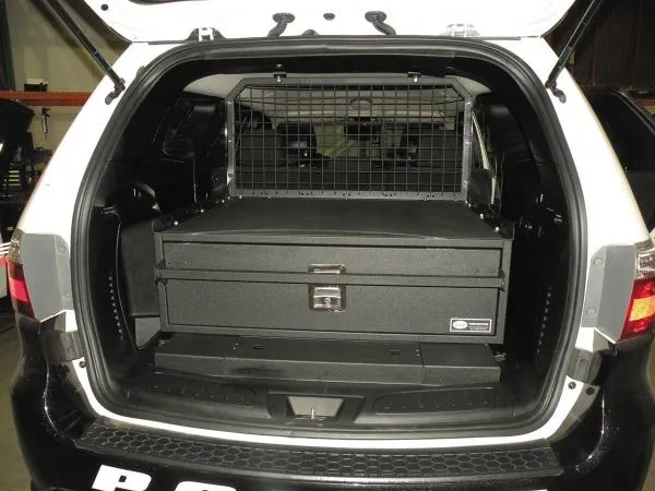 D&R 933-0102A single drawer storage system installed in the cargo area of a white Dodge Durango