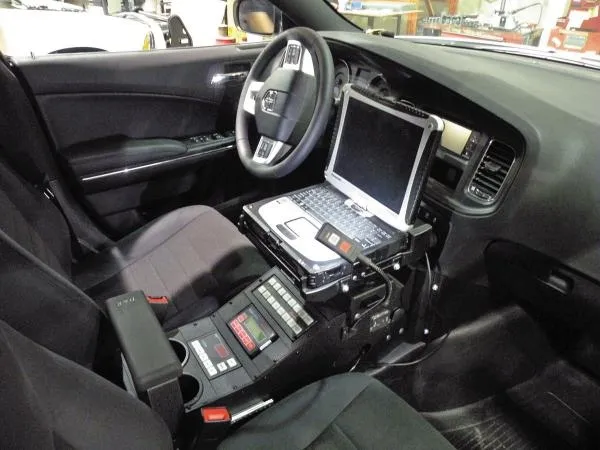 D&R 901-0086A console fitted in a Dodge Charger with laptop mount, siren control head and sliding armrest
