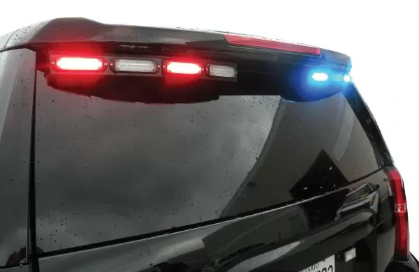 Wet Tahoe spoiler with the driver-side modules flashing red and the passenger side flashing blue