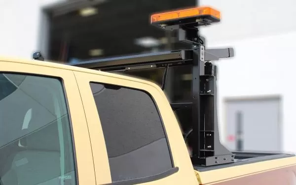 D&R MiniTech mini LED light bar with amber lens raised on an elevating pole above a utility truck box