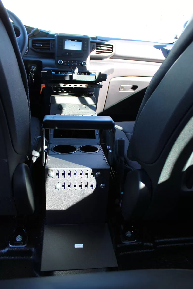Straight-on rear view of the console showing the vented side panel, cup holders and centre armrest