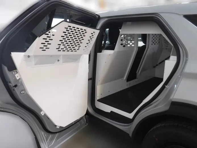 D&R 934-0887A full K9 kennel for the Ford Interceptor Utility, rear door open on the white insert