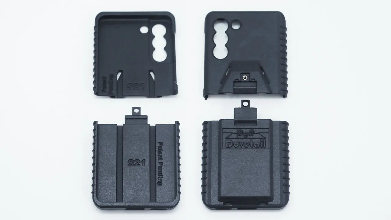 Four moulded case parts laid out flat, inner faces marked S21 beside the logo-stamped outer backs