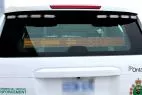 D&R RAT-A-40U amber LED message sign in the rear window of an enforcement SUV showing an arrow and STOP