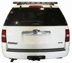 Rear view of a white Ford Explorer with the unlit 48-inch directional light bar mounted on the roof