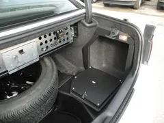 D&R 932-0014A trunk electronic mount door in a Dodge Charger beside the spare tire and equipment panel