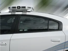 D&R WB-CHARGER window bars in the rear side window of a white Dodge Charger police cruiser