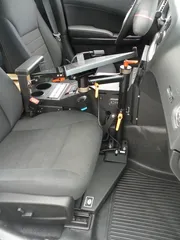 D&R LT6600 mounting kit for the Dodge Charger installed beside the console with orange lock handles