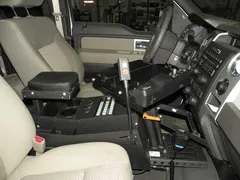 D&R SRCSUV 18" sloped emergency vehicle console fitted between the front seats with armrest and cup holders