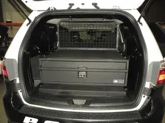 D&R 933-0102A single drawer storage system installed in the cargo area of a white Dodge Durango