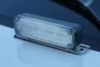 D&R Genesis LED light module deck mounted on a white cruiser hood, clear lens and stainless steel bracket