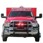Red rescue truck head-on with grille lights flashing red, speakers on the push bumper and a roof lightbar
