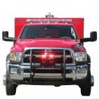 Red rescue truck head-on with grille lights flashing red, speakers on the push bumper and a roof lightbar