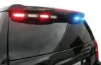 Wet Tahoe spoiler with the driver-side modules flashing red and the passenger side flashing blue
