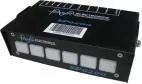 Top of the black case showing the printed output legend and the serial barcode on the lid