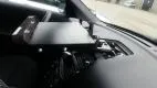 Close-up of the dash mount plate bolted to the passenger side of the dash with the dock body at left
