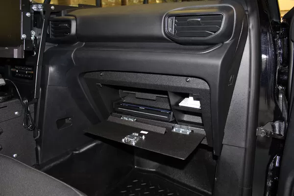 Wide dash view with the drop-down door open, showing the printer bay and side storage compartments