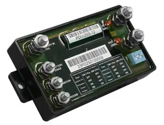 Tilted view showing the four-position DIP switch, side mounting bracket and low-profile black housing