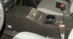 D&R 901-0124A console for the Dodge Ram installed between the seats with hinged lid and dual cup holders