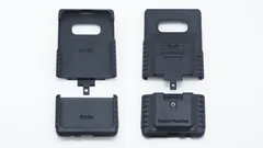 S10e case parts laid out with the lower caps taken off both the inside-up and outside-up shells