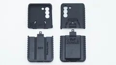 Four moulded case parts laid out flat, inner faces marked S21 beside the logo-stamped outer backs