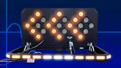 Alternating flash caught mid-pattern with the lightbar and its keypad controller lit on a blue backdrop